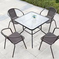 Ensemble table et chaises pliantes modernes en verre pour l'extérieur Mobilier durable en fer et corde pour jardin ou patio pour hôtels et appartements