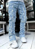 Celana Jeans Flare Bertumpuk Custom Laser Print Pria, Celana Denim Patchwork Berumbai Distressed Tebal, Celana Jeans Flare Skinny Hip Hop OEM