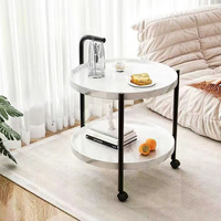 Table basse circulaire portable à double niveau en métal avec roulettes, design moderne et minimaliste pour salon, chambre à coucher, rangement de chevet