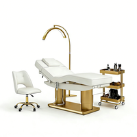 Lit de massage électrique de luxe moderne doré à double colonne pour salon de beauté, avec 4 moteurs et éclairage LED