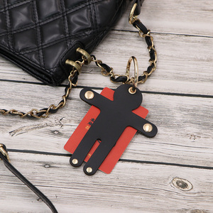 Llavero de moda de cuero PU con forma de persona pequeña, colgante creativo para bolso, llavero para coche, organizador de llaves portátil, regalos para bolso de mano - Product Image 1