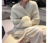 Cardigan en maille torsadée super longue pour femme, style tendance, à manches classiques, ouvert sur la poitrine, avec grandes poches, idéal pour l'hiver et les tenues décontractées