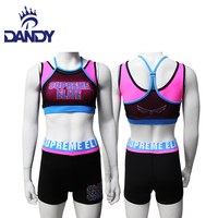 Tenues d'entraînement de cheerleading avec un design imprimé fantaisie, logo sublimé, hauts de danse et shorts personnalisés élégants