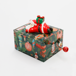 Caja Musical <span class=keywords><strong>de</strong></span> Acrílico Navideña EXTRAWORLD con Manivela, Melodía Personalizada y Diseño <span class=keywords><strong>de</strong></span> Santa Claus, Color Rojo/Verde - Product Image 1