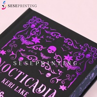 Livres à couverture rigide noir et blanc avec estampage à chaud violet personnalisé en Chine, impression de couverture et bords estampés et décalqués