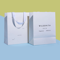 Sacs cadeaux en papier d'emballage personnalisés avec logo imprimé, motifs multicolores, papier artistique, vente chaude, avec ruban