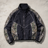 Veste coupe-vent personnalisée pour homme, style streetwear, avec patchwork camouflage, col montant et fermeture éclair, vêtement d'extérieur décontracté pour homme, vente en gros