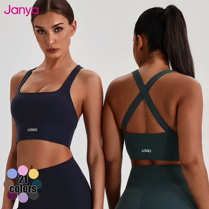 Janya Wholesale Breathable Quick Dry Solid Yoga Wear Custom Front Logo Cross Back Gym Fitness Tank Tops Sports Bras for Women
