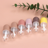 Vente en gros de mini tubes à gloss à lèvres créatifs en forme de pilule, avec bouchon blanc, emballage en capsule, tube à gloss à lèvres vide