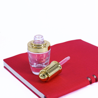 Flacon compte-gouttes en verre dépoli transparent de 30 ml (1 oz) avec bouton poussoir doré ou argenté pour sérum et huiles essentielles cosmétiques