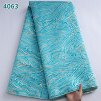 Tissu en dentelle brodée africaine bleue unie en gros 2025, dentelle damassée dorée brodée à la française pour robes de mariée femme 4063