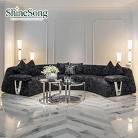 Canapé d'angle incurvé de luxe léger avec accoudoirs en métal, canapé en cuir moderne pour salon de villa