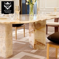 Table à manger rectangulaire moderne avec bords arrondis pour intérieurs haut de gamme, table à manger de luxe en marbre et acier inoxydable