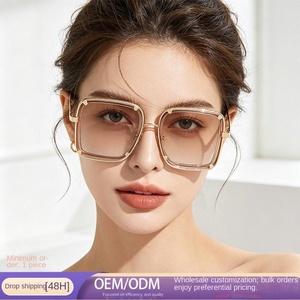 Lunettes de soleil rétro et tendance à monture large, avec branches métalliques courbées uniques, idéales pour les vacances à la plage et les voyages en voiture. - Product Image 1
