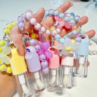 Tube vide pour gloss à lèvres 4ml avec grand applicateur, porte-clés fleur, emballage rond pour rouge à lèvres liquide, teinte à lèvres, huile à lèvres, gloss, laque à lèvres