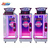 Machine d'arcade à monnayeur pour jeu de ciseaux 'Lucky 10 Second' avec défi ludique et grand prix en forme de poupée