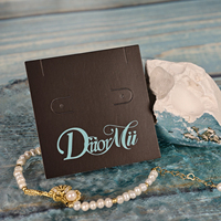 Cartes de présentation de bijoux en papier écologiques personnalisées de la marque USM, impression personnalisée du logo, emballage en sachet OPP, design personnalisé