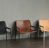 Fauteuil lounge en cuir pleine fleur tanné végétal, design danois moderne, pour projet hôtelier 5 étoiles, idéal pour salon.