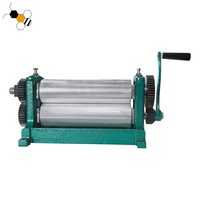 Machine manuelle d'embossage de fond de teint en cire d'abeille rouleau d'estampage à la cire d'abeille pour l'apiculture