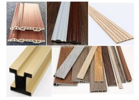 Machine polyvalente d'enveloppement de profilés à colle chaude pour produits en bois