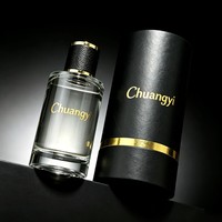 Flacon de parfum rond transparent en verre de 30 ml, 50 ml, 100 ml, avec bouchon en cuir texturé, logo personnalisé, et boîte cylindrique noire – Vente directe usine