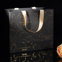Sac de shopping de luxe en papier noir haut de gamme avec estampage à chaud motif constellation et poignée en ruban pour emballage cadeau bijoux et produits de beauté