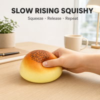 Jouet Squishy en forme de pain rond à remontée lente, garniture au sésame noir, anti-stress, compagnon de bureau
