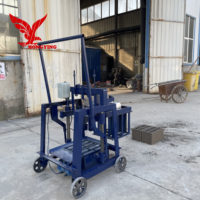 Prix de la machine à fabriquer des blocs de béton pour la ponte des œufs, machine à fabriquer des briques manuelles à emboîtement