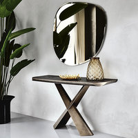 Table d'entrée minimaliste luxueuse de style italien Base en forme de X avec plateau en pierre placé contre le mur