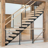 Escalier moderne en acier inoxydable avec structure mono-corps et marches en bois pour intérieur