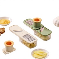 Hachoir à ail manuel multifonctionnel 3-en-1 en plastique pour usage domestique, idéal pour hacher, julienne, émincer et préparer une pâte d'ail.