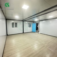 Petite maison conteneur à toit plat de 20 pieds à vendre Maison préfabriquée de luxe moderne et pliable extensible avec panneau mural sculpté en métal