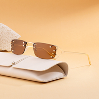 KAJILA Vente en gros de lunettes de soleil fantaisie à la mode avec logo personnalisé, monture rectangulaire sans monture, UV400, lunettes de soleil pour femmes