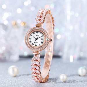 Montre pour femme vintage en or avec petit cadran en nacre serti de diamants, montre à quartz étanche polyvalente - Product Image 1