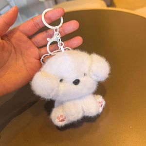 HECION Llavero de Peluche de Perrito con Lazo de 9cm, Adorable Muñeco de Peluche de Perro Pequeño para Parejas, Colgante para Mochila, Decoración, Regalo - Product Image 2