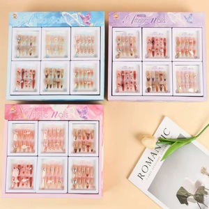 Ongles artistiques, faux ongles portables, longueur moyenne, acrylique, pour femmes et enfants, motifs aléatoires nœud et ciel étoilé - Product Image 1