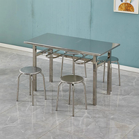 Table et chaises de salle à manger en acier inoxydable de style industriel moderne. Convient aux restaurants, écoles et hôtels.