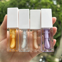 Huile à lèvres hydratante végane waterproof à marque privée, gloss repulpant, faible MOQ, logo personnalisé, liquide transparent pour le soin des lèvres
