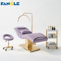 Nouveau style : Ensemble lit de soin et chariot à base dorée, lit SPA vert haut de gamme pour centre de bien-être féminin, table de massage électrique réglable
