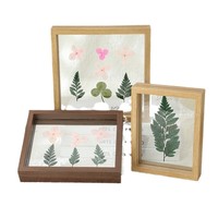 Nouveau modèle en gros, cadre photo en bois moderne double face, support de présentation paysager créatif avec sculpture de feuilles, cadre photo ajouré
