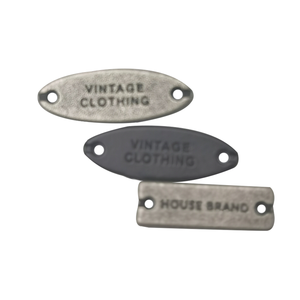 Hình Chữ Nhật Hình Dạng Hình Bầu Dục Khắc Tấm Tag Dập Nổi Kim Loại May Trên Tùy Chỉnh Quần Áo Nhãn Cho Hàng May Mặc - Product Image 1