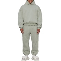 Ensemble survêtement homme en molleton de coton épais, coupe oversize à épaules tombantes, comprenant un sweat à capuche et un pantalon de jogging
