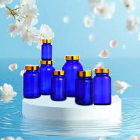 Vente en gros de 75ml 100ml 120ml 150ml 200ml 250ml 300ml 400ml 500ml Capsule pharmaceutique en verre bleu avec bouchon à vis