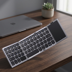 Super slim three-speed folding keyboard rechargeable portable wireless folding keyboard with touchpad for <b>tablets</b> - Product Image 1
