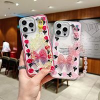 Coque de téléphone de luxe antichoc 3D avec nœud papillon et motif tulipe pour A17/A15/A13/A04e avec dragonne papillon – Vente en gros