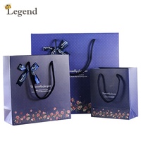 Sacs en papier cadeau floraux en gros avec nœud en ruban, sacs en papier personnalisés avec logo imprimé pour emballage de cadeaux de mariage et d'anniversaire