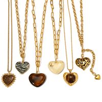Collier vintage pour la Saint-Valentin, en acier inoxydable, chaîne plate ovale, pendentif cœur blanc et marron pour pull