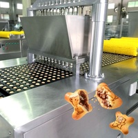 Ligne de production industrielle complète de biscuits creux imprimés motif panda, avec mélange, formage, cuisson et remplissage de la pâte