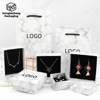 Boîte à bijoux élégante en papier marbré blanc avec logo personnalisé HKSHF Pro Supplier, écologique et durable, pour cadeau de mariage