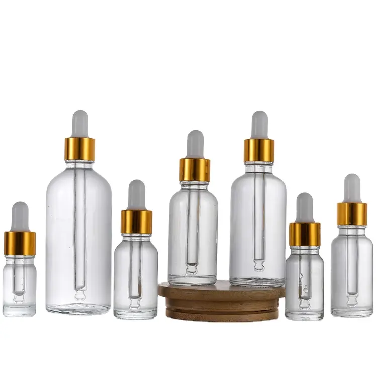 New Product 10ml 15ml 30ml 50ml 100ml Luxury Hair Oil Clear Pink Glass Dropper Bottle Golden Essential Oil Bottles